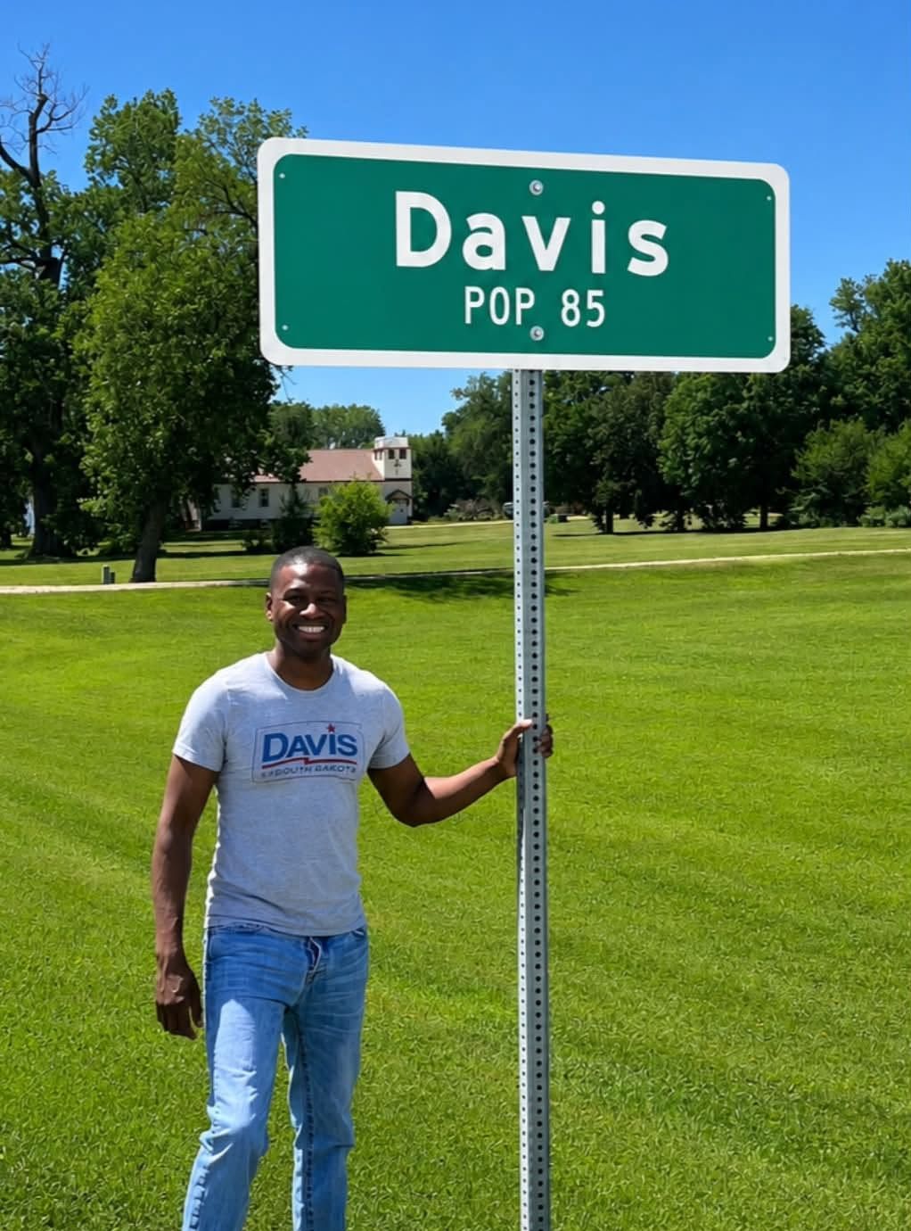 Terrence Davis beside the Davis, South Dakota town sign, population 85